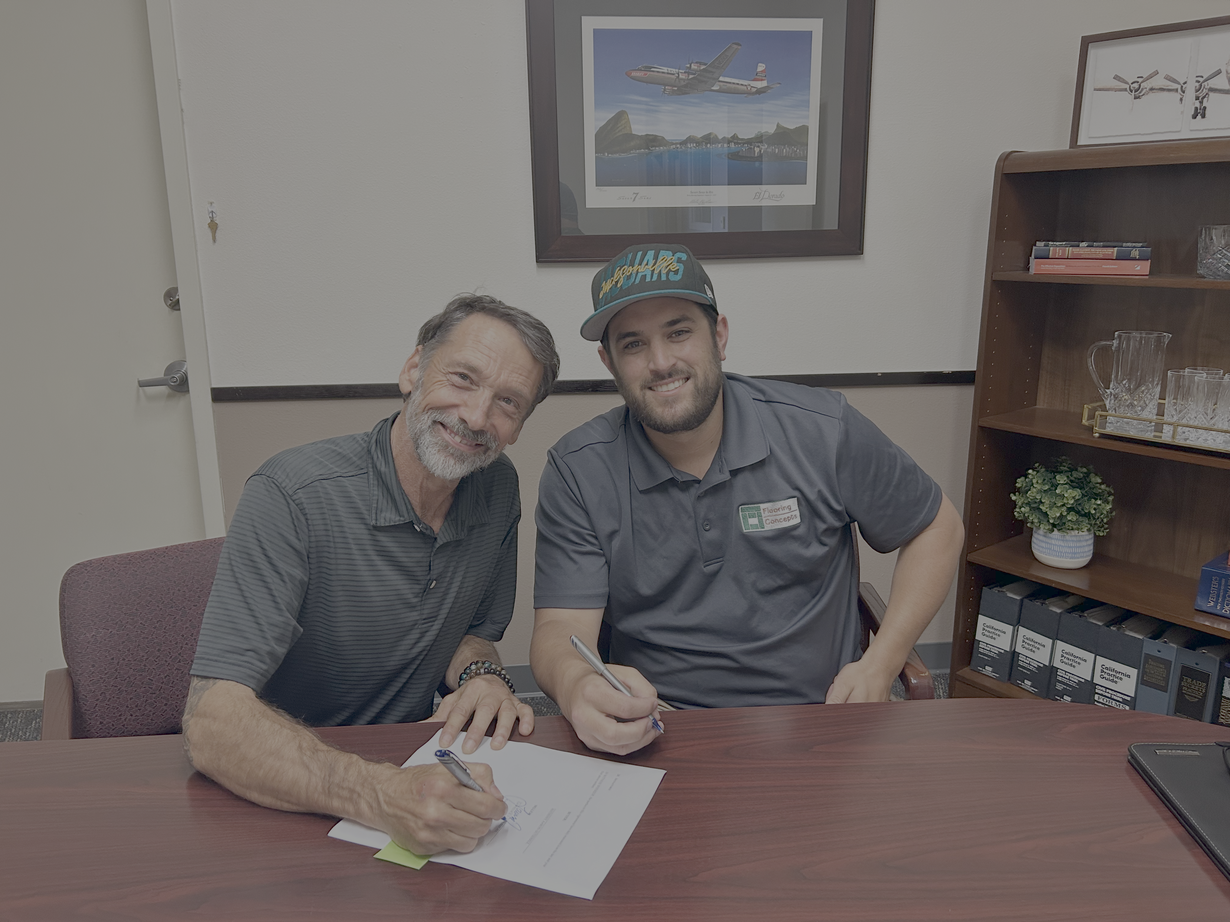 Aaron with the previous owner on the day he purchased Flooring Concepts